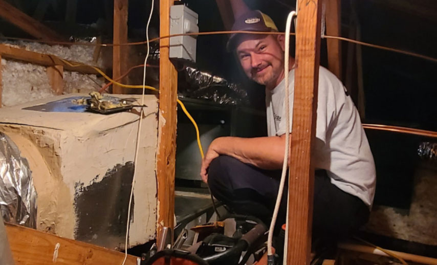 Technician performing furnace repair
