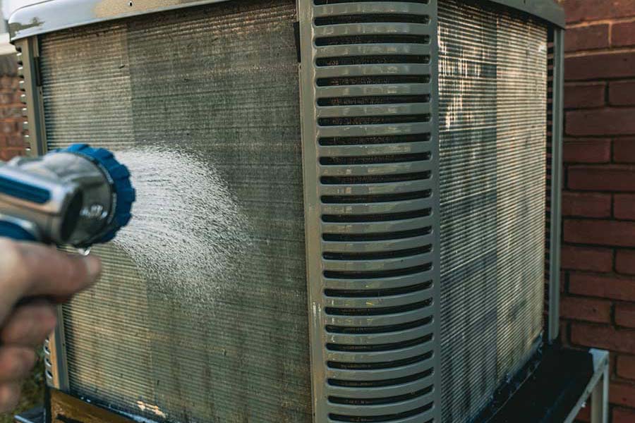 AC coil cleaning in progress