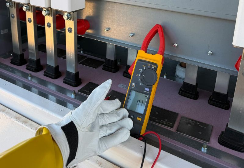 Electrical technician completing surge protector installation