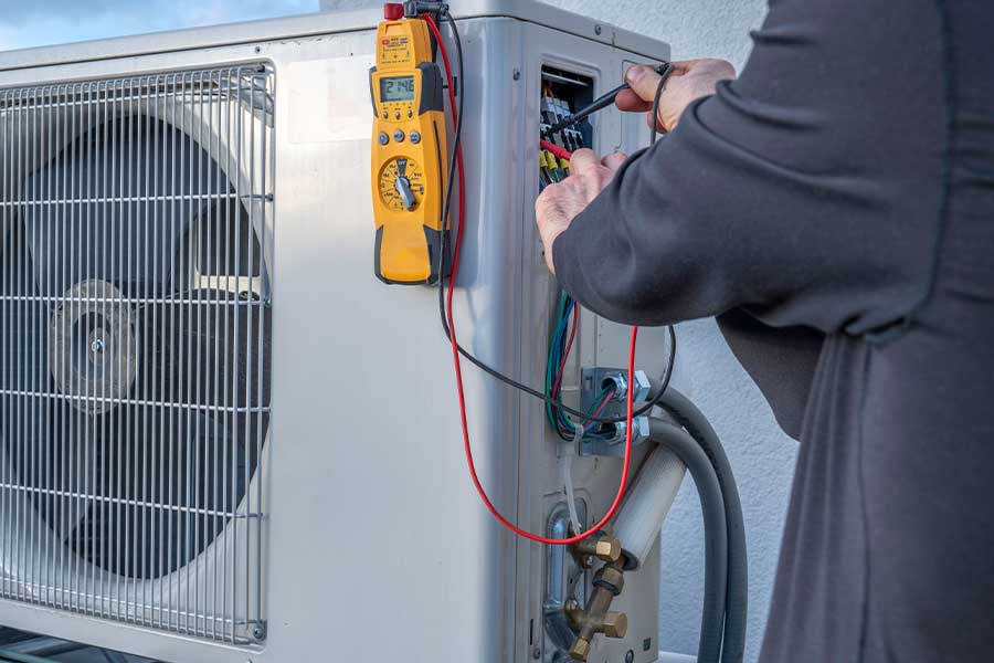 Technician performing ductless mini split repair service