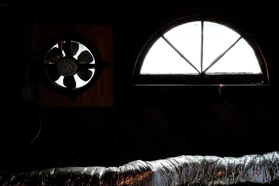 Attic fan installation service in progress